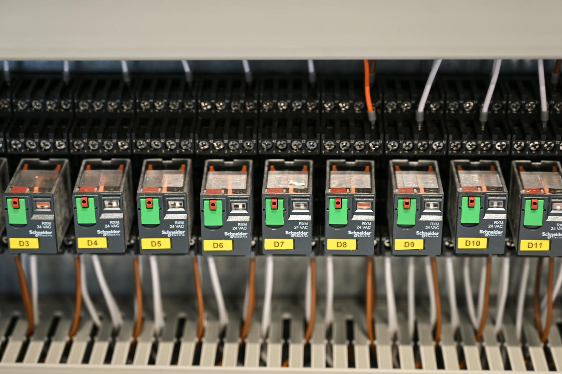 close-up of neatly arranged electrical terminals and circuit breaker panel, DSLR quality