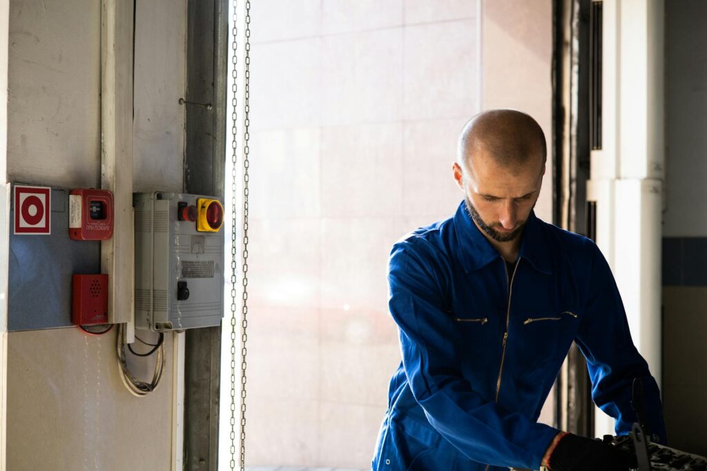 electrician inspecting circuit breaker panel for overload