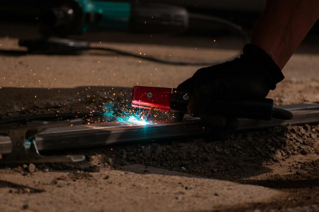close-up of a melted electrical outlet with sparks and smoke