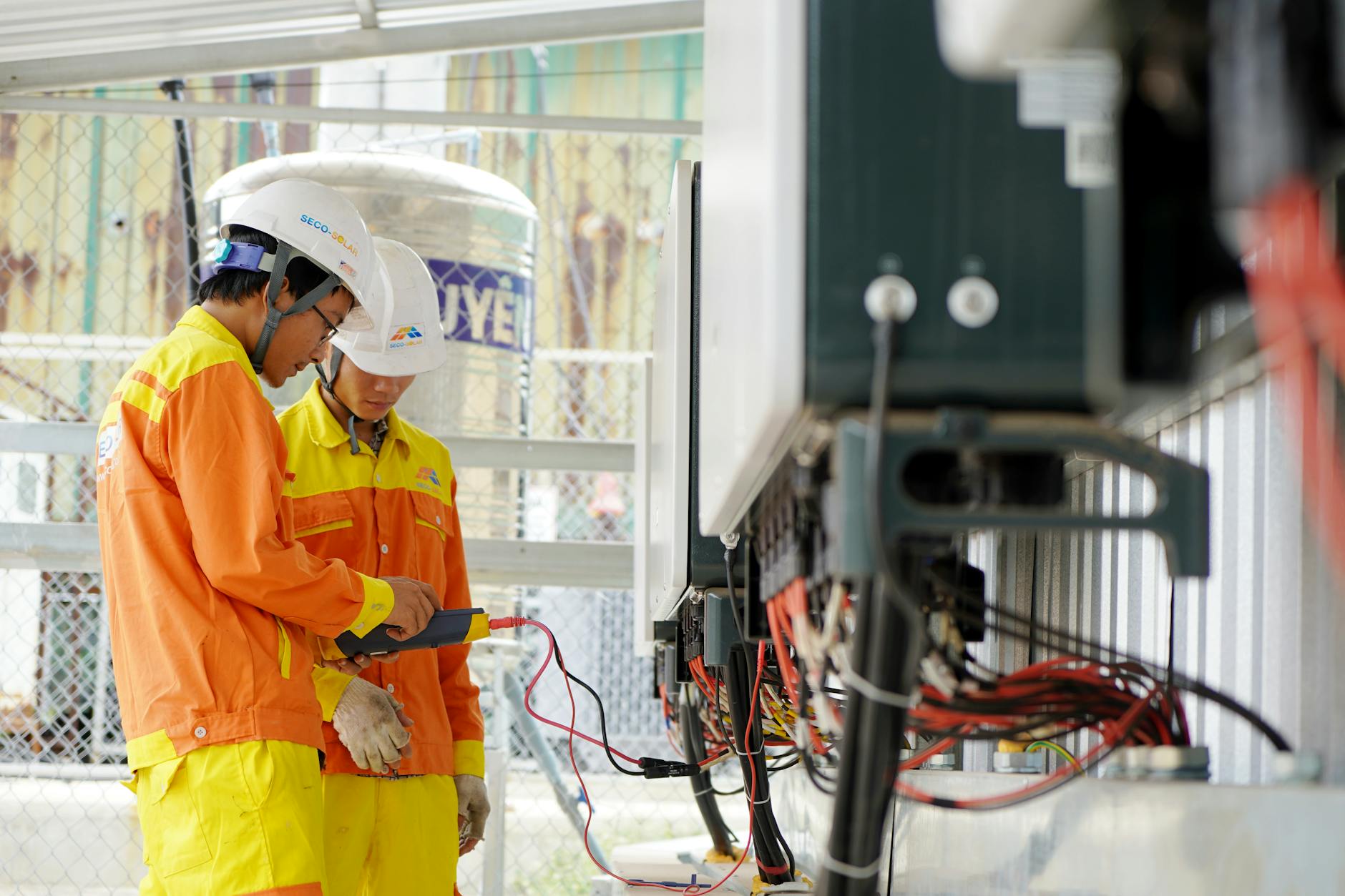 electrician checking hot wiring with thermal camera