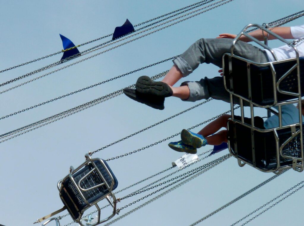 electrician hand connecting wires to circuit breaker