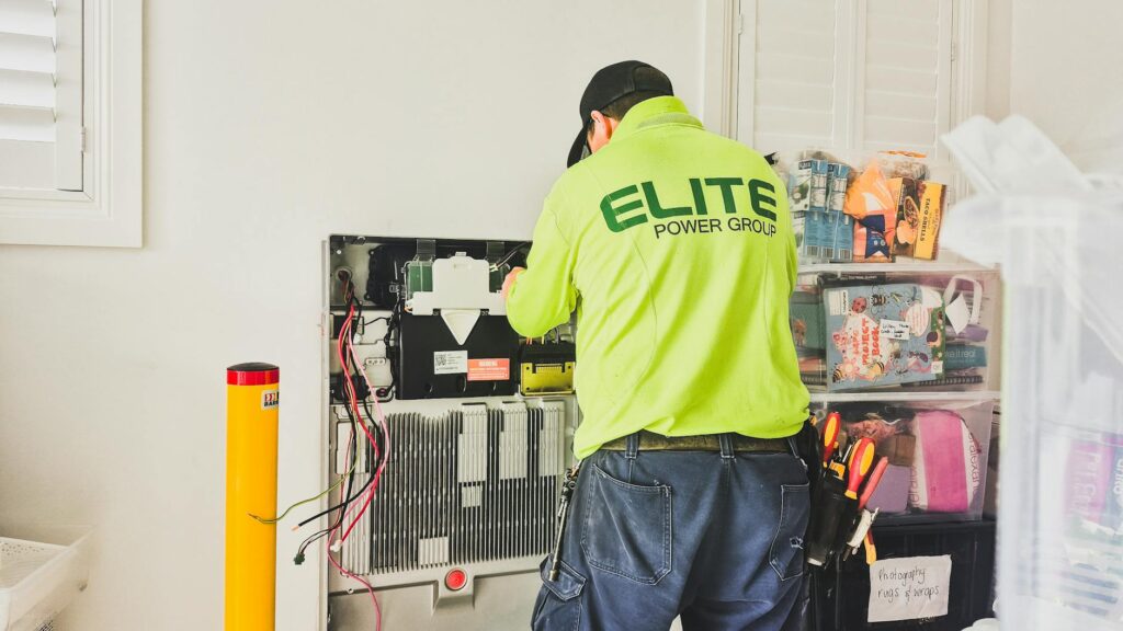 electrician installing ground rod for residential grounding system