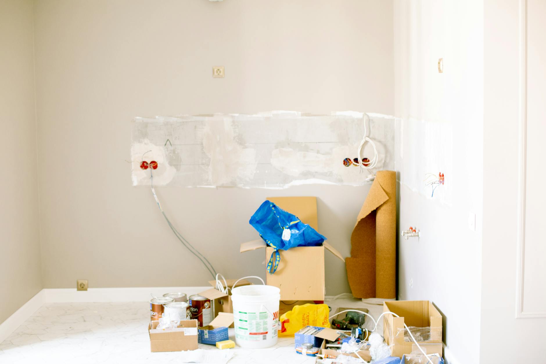 electrician installing wall socket wiring