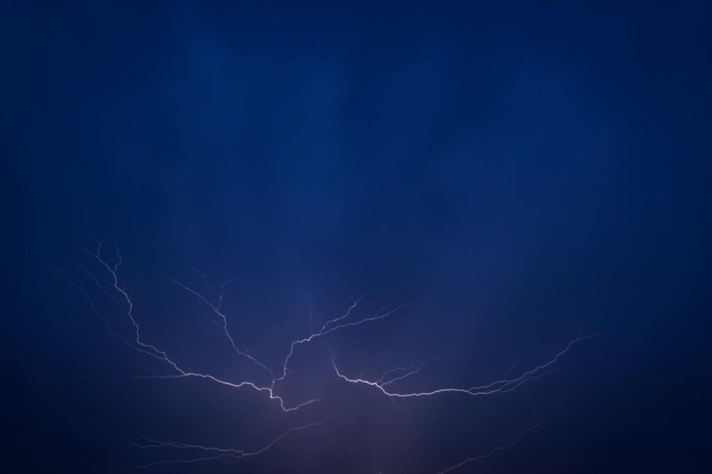 overloaded electrical panel at night with sparks